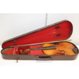 A vintage violin in a wooden case