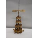 A four tiered candle powered wooden revolving toy