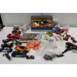 A box of assorted Scalextric slot cars & other