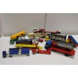 A selection of mixed play worn die-cast trucks & trailers