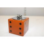 A vintage 1930's dice form table lighter