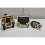 Three vintage hand held games