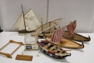 A box of wooden boat models
