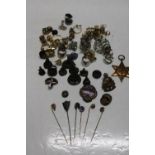 A selection of costume jewellery, badges, seals & other items