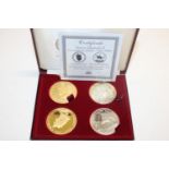 A cased gold & silver plated coin set