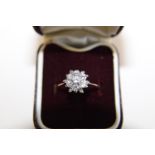 A 18ct gold & multi cluster diamond snow flake design ring. (see valuation)