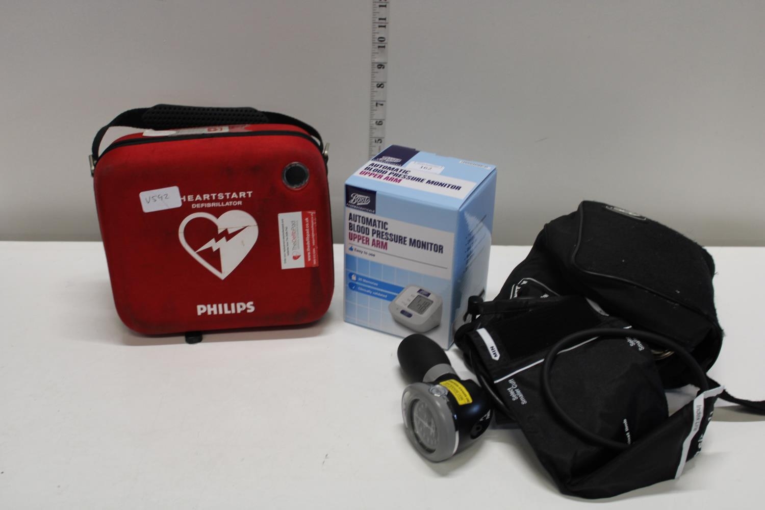 A selection medical equipment including blood pressure monitors and a defibrillator.