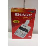 A boxed Sharp electronic printing calculator