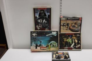 Four vintage Star Wars puzzles & box of Star Wars chocolates (un-checked)