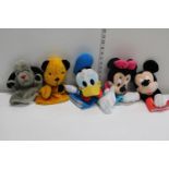 A selection of Disney and Sooty and Sweep hand puppets.