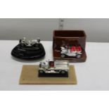 Three novelty desk top car models