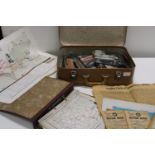 A vintage suitcase & contents of war years ephemera