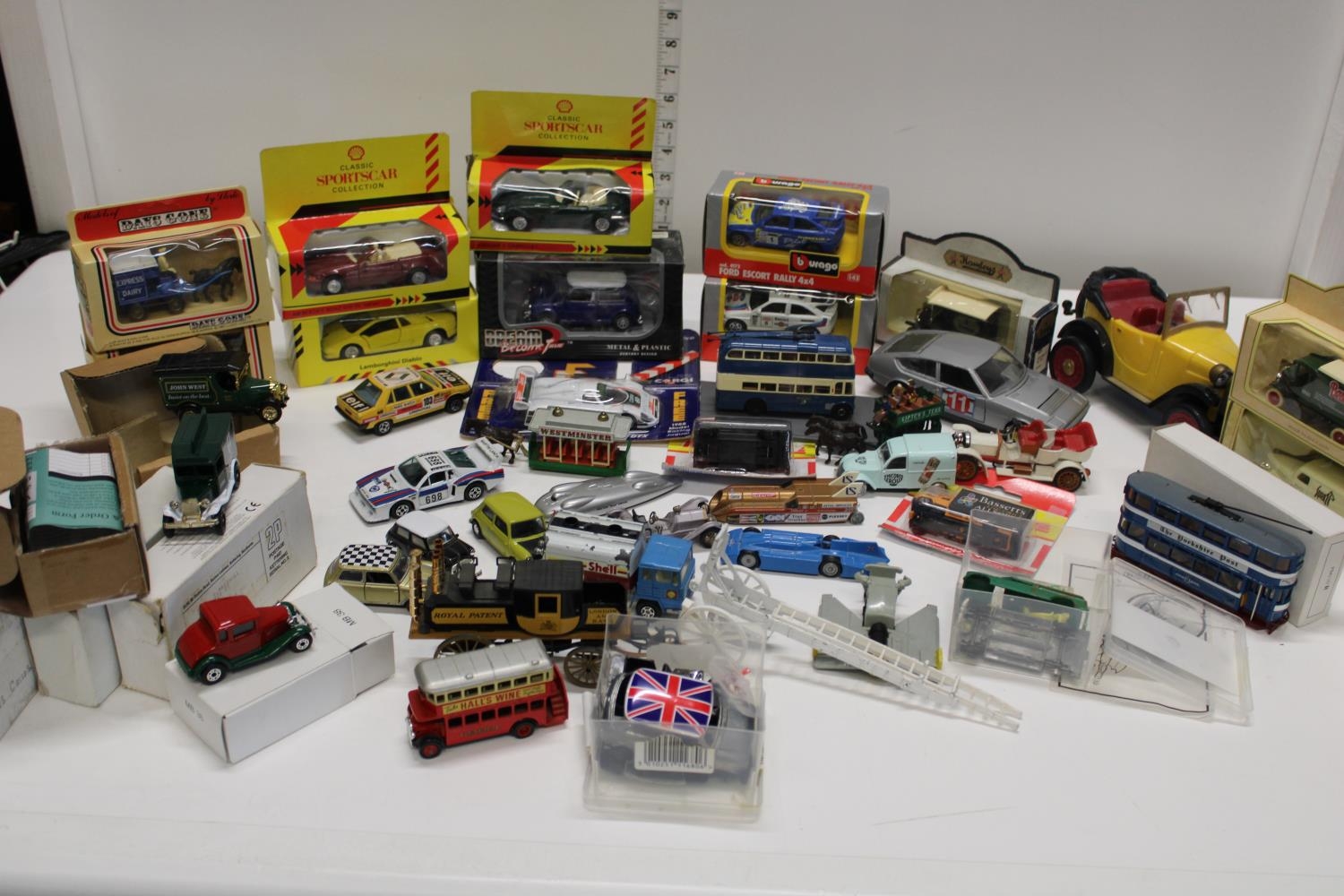 A large qty of assorted die-cast models etc