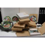 A large selection of boxed assorted collectors plates