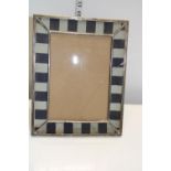 A large hallmarked silver picture frame (needs new glass) hallmarked for London 1915