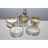 Five assorted hallmarked silver napkin rings. Gross weight 100 grams