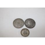 Three pre 1936 silver coins including a Victorian florin