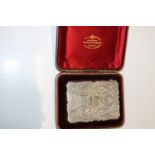 A stunning silver calling card case in a fitted presentation box with monogram on the cartouche.