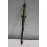 A antique brass garden sprayer