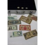 A coin collectors case & contents of coins