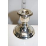 A loaded squat silver candlestick hallmarked for Birmingham 1916. Gross weight 200 grams