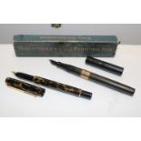 A vintage Waterman fountain pen with a 9ct gold band on the body. With inscription. And a Parker