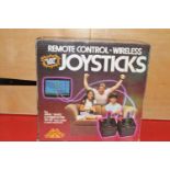 A boxed set of vintage gaming joysticks