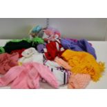 A box of new woollen knitted items & loose wool etc