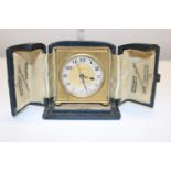 A small vintage Zenith travel clock in a fitted case. (not working)