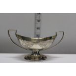 A hallmarked silver & gilt two handled sugar bowl. Hallmarked for London 1888. 70 grams