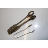 A large pair of Georgian sugar nips/tongs hallmarked for London 1836. And a smaller pair of sugar