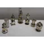 A selection of assorted hallmarked silver pepperettes etc