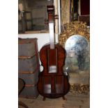 A novelty CD rack in the form of a Cello collection only