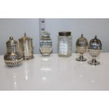 A selection of hallmarked silver pepperettes & one silver topped salt cellar