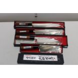 Four boxed new Japanese kitchen knives