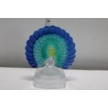 A vintage glass peacock on stand