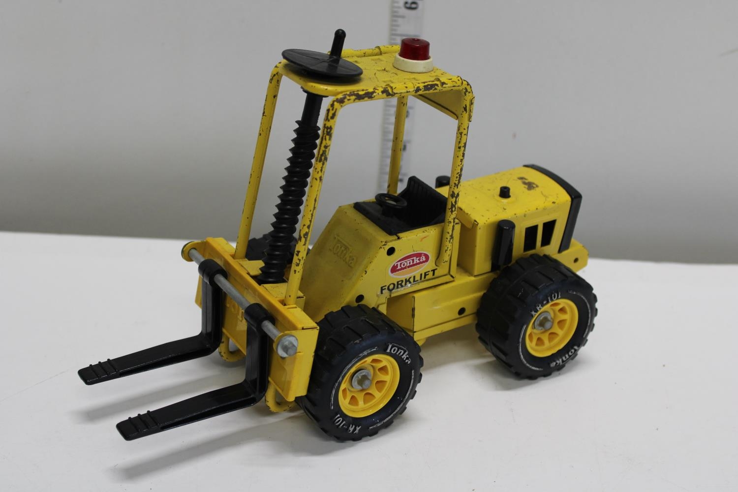 A vintage Tonka Toy metal fork lift