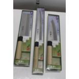 Three boxed new Japanese kitchen knives