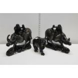 Two wooden hand carved water buffalo figural sculptures with fine silvered inlay damage to one