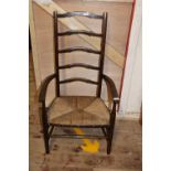 A vintage mahogany ladder back chair with rush seat collection only