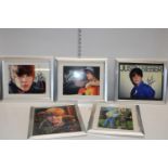 Five framed and signed Justin Bieber photographs