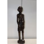 An unusual hand carved tall African figure