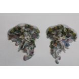 A pair of German Sitzendorf porcelain wall sconces