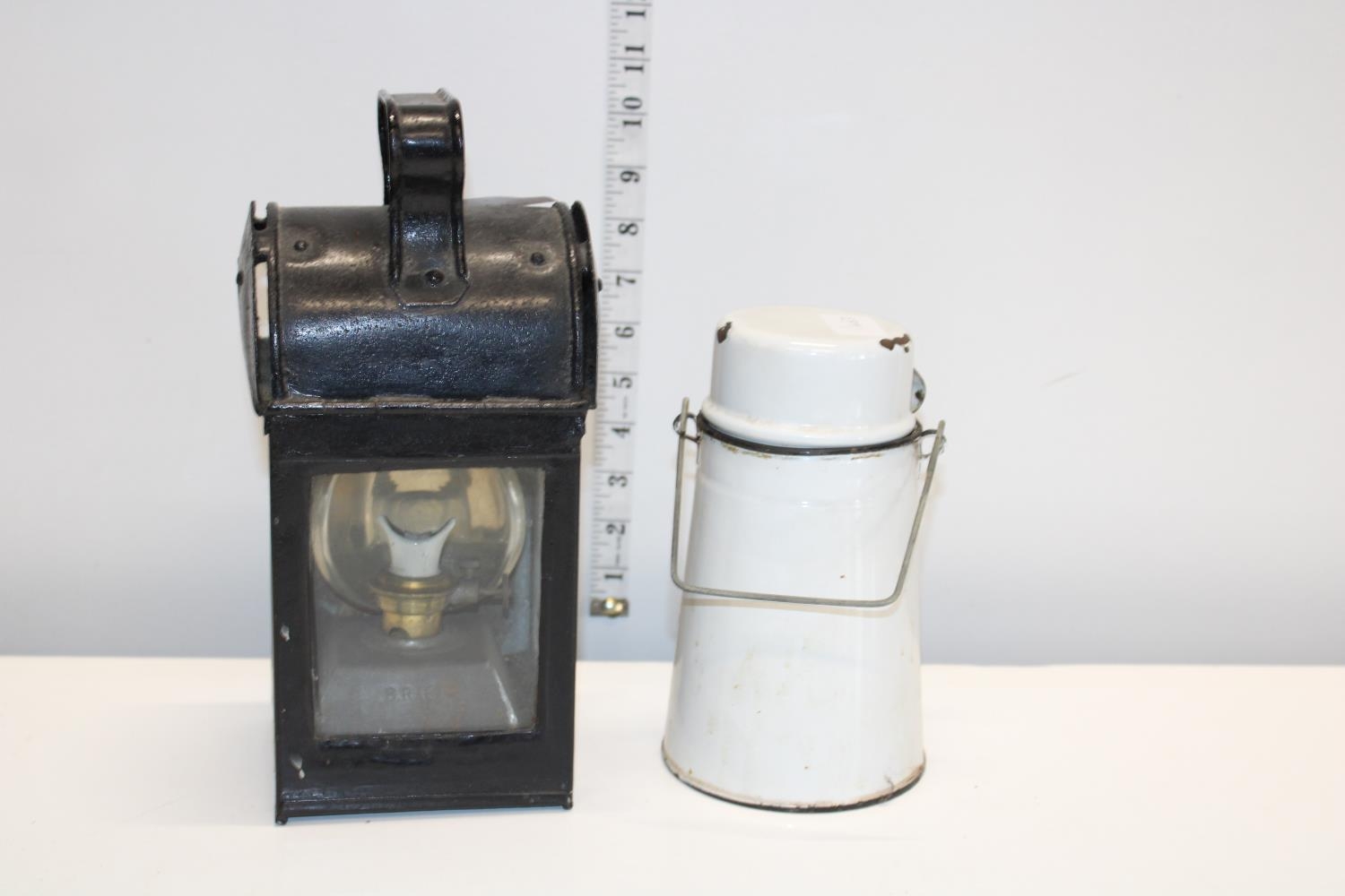 A vintage oil lamp & enamel ware flask