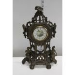 A cast metal mantel clock
