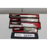 Four boxed new Japanese kitchen knives