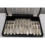 A cased set of vintage pearlescent handled cutlery