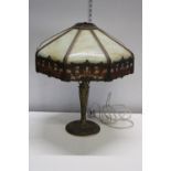 A large American Tiffany style table lamp with a beautiful metal base