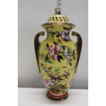 A large yellow ground lidded vase with floral decoration. Stamped F to the base with 5544 stamp