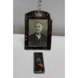 A antique tortoise shell picture frame with silver inlay & trinket box cover. Frame has some